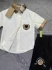 Nowy projekt projektantki dresu dziecięcego Zestaw koszuli polo Rozmiar 90-140 Logo druk dla chłopców T-shirty i elastyczne talii krótkie dec05