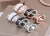 Högkvalitativ modering Titanium Steel Black White Ceramics Rings Silver Rose Gold Ring Finger Gift for Girl Jewelry S2306689390