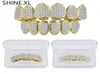 Denti da vampiro Hip Hop placcato oro argento Grillz superiore e inferiore ghiacciato micro pavimenta CZ pietra bling gioielli per il corpo5825415