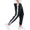 Mensbyxor Butt Side Basketball Men Loose Fit Trainers Male Joggar med elastiska manschetter Sweatpants Träning utomhusbottnar