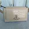 Bolsa feminina Saturn com design de nicho, bolsa baguete com padrão de crocodilo, bolsa crossbody na moda