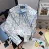 Camicette da donna Korejepo Camicie che riducono l'età Collo a bambola a maniche lunghe Camicia con stampa in stile cinese 2023 Donna Inizio autunno Francese Loose Chic