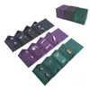 Bolsas de joyería Calidad superior Caja de embalaje de cuero genuino negro Pendiente Broche Caja de almacenamiento Viaje y exhibición Rollo