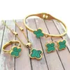 Designer för Woman Gold Plated Four Leaf Clover Earrings Set Fashion Red Agate Halsband Bröllopsfest smycken gåva 4-delad kombinationsdräkt