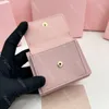 Diseño de lujo de cuero genuino de las mujeres de moda casual arco portátil tarjeta bolsa multifuncional lindo corto de gama alta cero billetera rosa negro