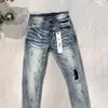 Designer lila trend nöd Svart rippade smala motorcykel jeans män lösa hål