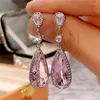 Boucles d'oreilles pendantes rose CZ pour femmes, couleur argent de luxe, accessoires féminins élégants, bijoux de déclaration de fête de danse, vente en gros