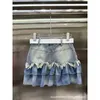 Faldas Diseñador verano nuevo diseño de nicho marca de moda denim patchwork malla irregular moda versátil media falda YISL