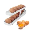 Organisation de stockage de cuisine Défilement automatique Egg Rack Holder Box Panier Conteneur Organisateur Rolldown Réfrigérateur Distributeur pour 231216