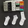 Chaussettes pour hommes femmes coton tout-match chaussettes de couleur unie pantoufles classique crochet cheville respirant noir blanc gris football basket-ball bas de sport chaussettes de sport de luxe