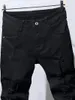 Męskie dżinsy mężczyźni Szczupły motocyklista rozryli długie dżinsowe spodnie chude kieszonkowe młody mężczyzna jogging spodnie zniszczone elastyczne czarne