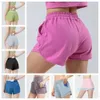 Abiti da yoga Abiti da donna di marca Pantaloncini lulu Pantaloni corti firmati per esercizi con tasca con cerniera Abbigliamento fitness Ragazze che corrono Elastico F