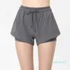 Abiti da yoga Abiti da donna di marca Pantaloncini lulu Pantaloni corti firmati per esercizi con tasca con cerniera Abbigliamento fitness Ragazze che corrono Elastico F