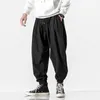Spodnie męskie swobodne spodnie hip -hop luźne styl High Street Pasek na zewnątrz sport sporty jogging moda Harlan gorset kostka anime gym 231216