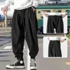 Spodnie męskie swobodne spodnie hip -hop luźne styl High Street Pasek na zewnątrz sport sporty jogging moda Harlan gorset kostka anime gym 231216