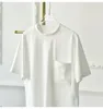 T-shirt da donna Camicia in cotone ricamato con tasca di fascia alta Donna Estate manica corta Grigio Bianco Top sciolto moda tinta unita