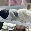 Berretti a filo palla ispessita caldo cappello carino protezione per le orecchie berretti invernali lavorati a maglia di lana sopra la testa imitazione di alta qualità