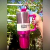 Sell Well Pink Co-Branded Pink Parade Target Red with H2.0 40oz Stainless Steel Tumblers Cups Silicone Handle Lid Straw Travel Car Mugs