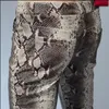Hommes pantalons mode hommes mince Faux Python serpent imprimé en cuir personnalité PU pantalon Chandal mâle de haute qualité 231218