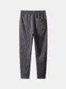 Pantalons sanitaires gris série Mengkouqin pour hommes au printemps et en automne nouveaux leggings de sport de style américain pantalons décontractés pantalons tricotés de marque à la mode