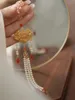 Broches 1 pièces femmes Cheongsam pressé revers gland suspendu pendentif décoration Style chinois élégant tempérament Costume accessoires cadeau