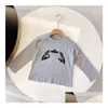 Les garçons et les filles portent une chemise à manches longues et à manches longues pour enfants de printemps et d'hiver T-shirt de marque de vêtements tendance taille 90-150 cm Drop de Dhvkj