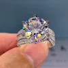 Stunning 5 Ct Pigeon Egg Moissanite Three-Stone Ring with Triple Rows of Simulated Diamond