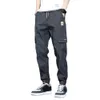 Pantaloni da uomo Tasche laterali da uomo Cargo Harem Nastri Pantaloni da jogging maschili casual Hip Hop neri Moda Streetwear 231218