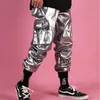 Pantalons pour hommes Hommes Streetwear Hip Hop Punk Argent Cuir Mâle Brillant Pantalon Métallique Personnalité Harem Multi Poche Cargo Vêtement 231218