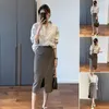Werkjurken 2023 herfst Koreaanse versie van het casual ouder wordende senior sense sense hong kong windhirt en een halve rok tweedelig pak