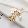 Bag Parts Accessories Luxury Artificial Pearl Keychain Metal Peach Heart Pendant Keyring Women Fashion Headphone Case Charm Jewelry 231219