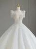 2024 Lindos vestidos de noiva de bling Cristais Cristais Bridal Short Manga Princesa Vestido de Ball Wed Tulle Uma linha Ruched Plus Size Country Country Beach Vestido De