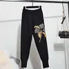 Pantaloni a due pezzi da donna Primavera Autunno Lusso Donna Svasati ricamati 2 Set Tuta Maglione lavorato a maglia Top Abiti casual a due pezzi 231219