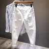 Mens Jeans White Men AllMatch Fashion Ripped Hole Slim Stretch Harem Pants Bekväma Male Streetwear Denim Trousers 231218