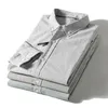 남성용 캐주얼 셔츠 패션 트렌드 코튼 패브릭 한국어 버전의 상쾌한 문학적 팬 라펠 긴팔 줄무늬 셔츠