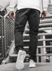 Męskie spodnie cargo y2K Hip Hop Print Multi Pocket kombinezon Punk Rock szeroko zakrojona noga ponadgrzeznana streetweard dla męskich swobodnych joggerów luźne spodnie dresowe azjatyckie rozmiar m-3xl
