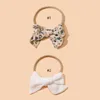 Accessoires de cheveux bébé pour né pour tout-petit pour enfants fille garçon coton coton mignon bowknot imprimer le bandeau de couleurs de couleur