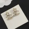 Luxury Luxury Full Full Diamond Automne et hiver Nouvelles boucles d'oreilles à double lettre Femelle minoritaire Temperament étoile à cinq points boucles d'oreilles Sense Send