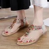 Sandaler Summer Women's Border Casual Flat Shoes Plus Size storlek Etnisk stil strängpärlor för kvinnor med tåavskiljare