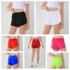 Kostuums nieuwe mode top look look dames hoge taille hardloop shorts snel droge atletische workout shorts met mesh voering ritszakken zakken