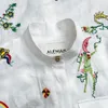 Australisk designerklänning 2024 Ny mantel vit linne broderad liten stand up krage lös midjeband skjorta stil klänningar för kvinnor