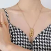 Collane con ciondolo Collana con orecchini con ciondolo abbinata alla collana a catena del maglione da donna dell'ultimo designer, acciaio al titanio, metallo, gioielli alla moda che non sbiadiscono M7OI