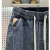 Calças de brim masculinas moda casual jogger harem calças jeans hip hop nova cintura elástica carta impressão calças jeans 2023 outono l231220