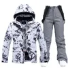 Set di tute da neve impermeabili per donna Abbigliamento da snowboard Costumi da sci Abbigliamento invernale Giacca con cinturino Pantalone per ragazza Colori 231220