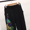 Dwuczęściowe spodnie dla kobiet jesienne moda czarna dzianina zestaw kobiet cekiny Peacock Sweter długi 2
