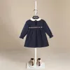 Filles Robe d'automne Couleur massive Round Ruffle Ruffle rayée à manches longues Coton Linn une ligne avec des boutons arrière pour les enfants 2 7 ans 231221