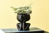 Estilo nórdico Humano pense Face Cerâmica Plantas domésticas Flor Storage Pote Vaso Planter Decoração Y03146101046