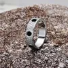 Wysokie wydanie czarne ceramiczne pierścienie miłosne Wedding Połączka Women Mężczyźni Mężczyźni śrubowe 3 rzędy Diamond Paved 316L Titanium Steel Designer Jewel236i