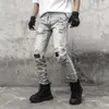 Europe United States High Street Camouflage tissu apposé patch lavage Les trous d'eau font les vieux jeans pantalon de hip hop masculin zipper
