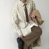 Automne japonais rétro Reverse à rayures luxueuse à rayures pour hommes boutons à manches longues décontractées mode vêtements coréens hawaïen 231221